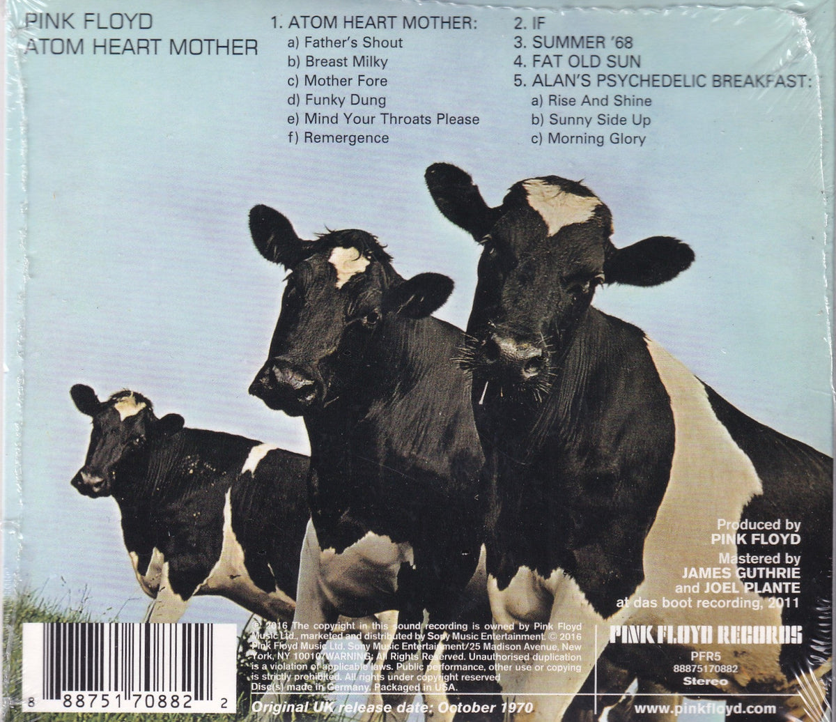 Back cover of Pink Floyd's 'Atom Heart Mother' vinyl record, showing a herd of black and white cows against a pale blue sky, with tracklist text and barcode details.