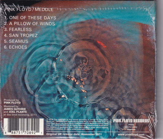 Back cover of Pink Floyd's 'Meddle' vinyl record sleeve, sealed in plastic shrink wrap. The artwork features a swirling abstract design in teal, brown, and black, with the tracklist and Pink Floyd Records branding printed on the cover.